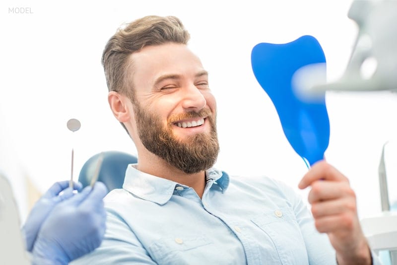 man smiling in dentist chair