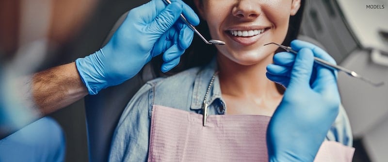 Woman at the dentist getting a checkup