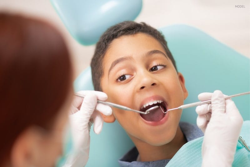 young boy at the dentist having a regular check up