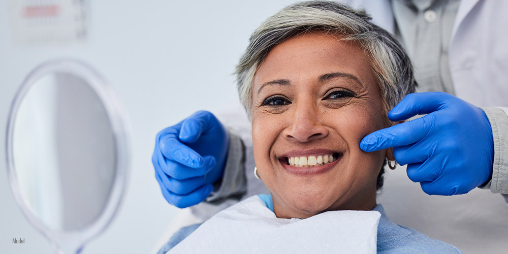 happy female patient at dental office