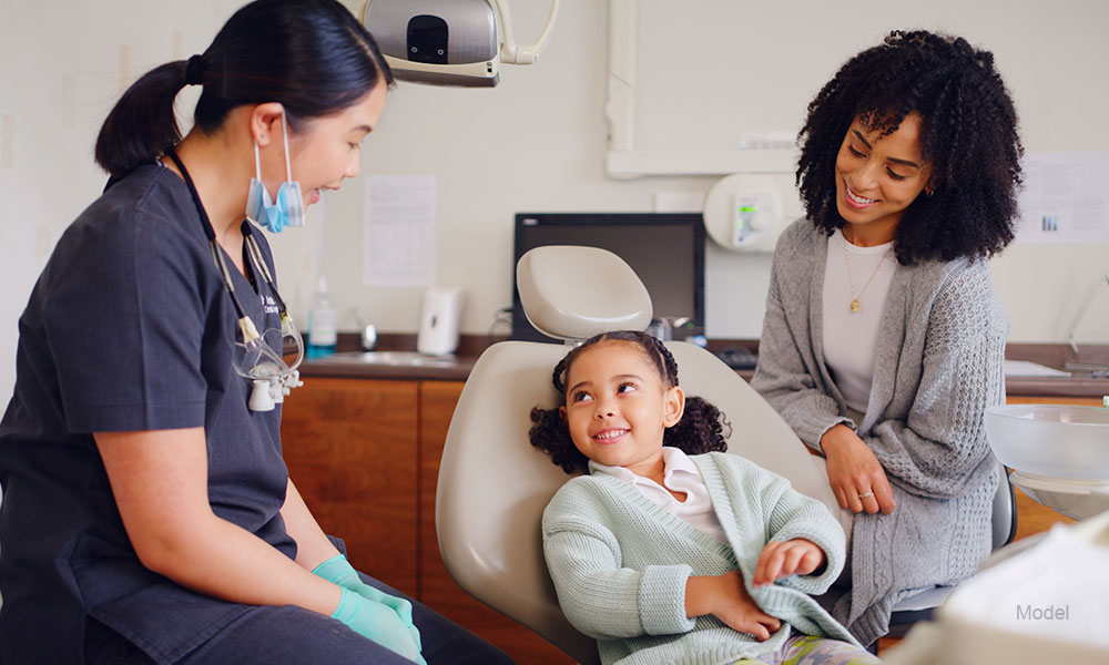 Girl, smile in a dentist consultation 